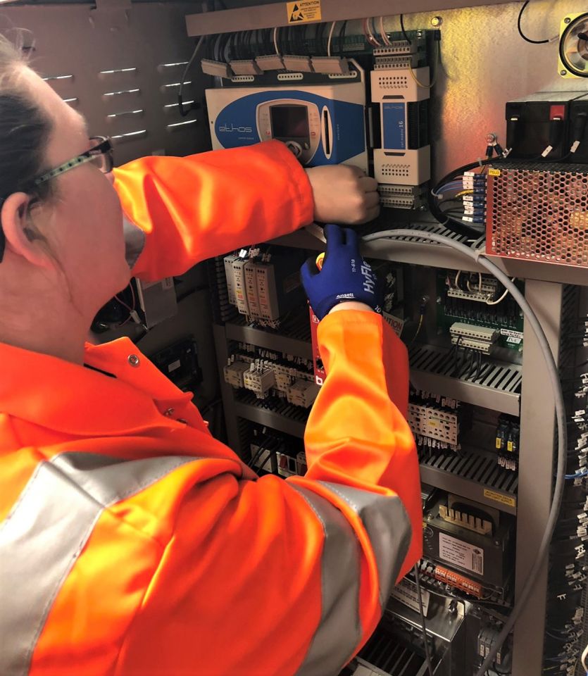 Charlene working on lift electronics