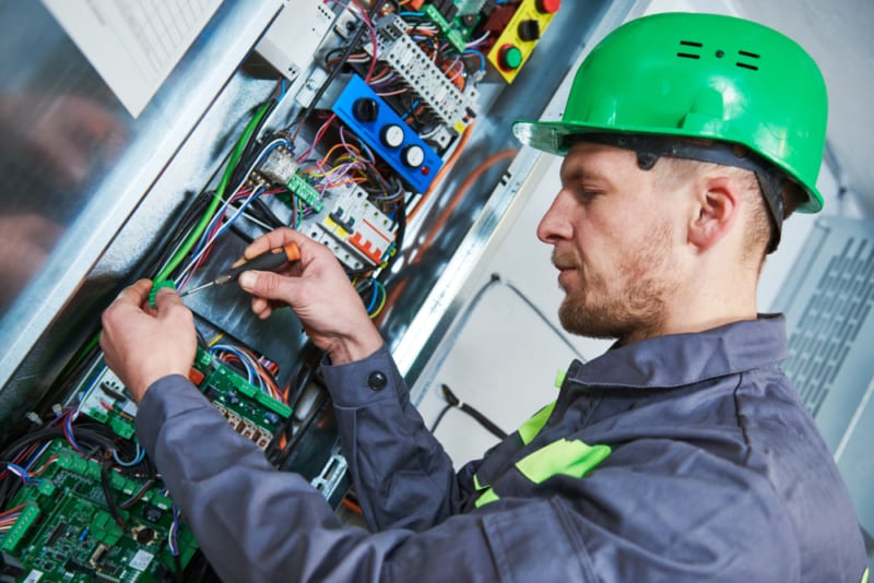 Lift engineer working on electrics